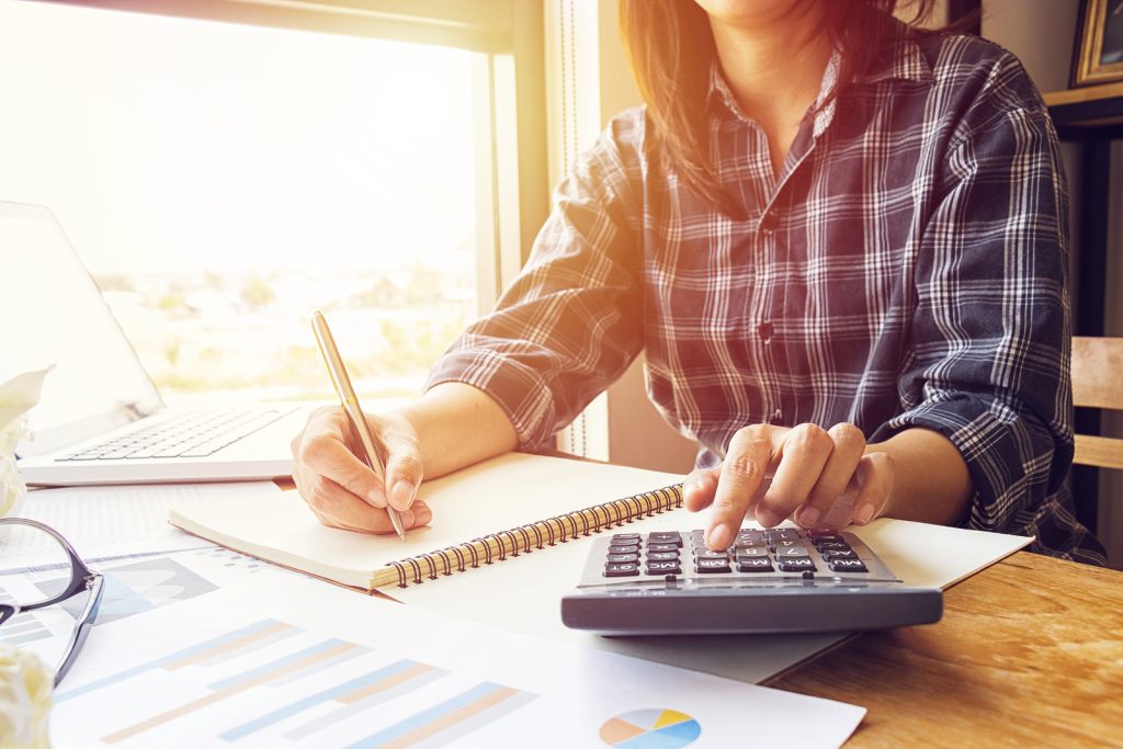 Woman calculating their debt-to-income