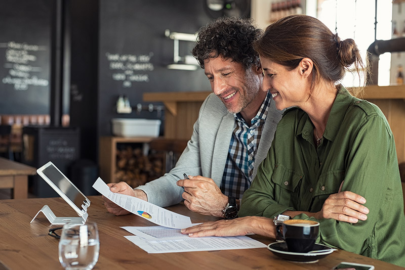 couple opening an IRA and smiling about it