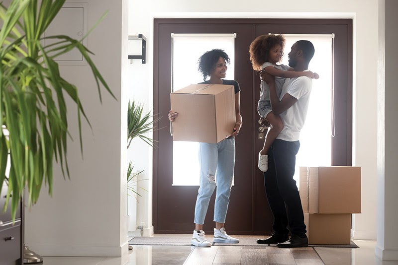 couple with kid moving into a new home