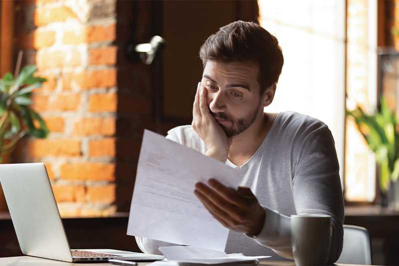 Man using balance transfer to pay off debt