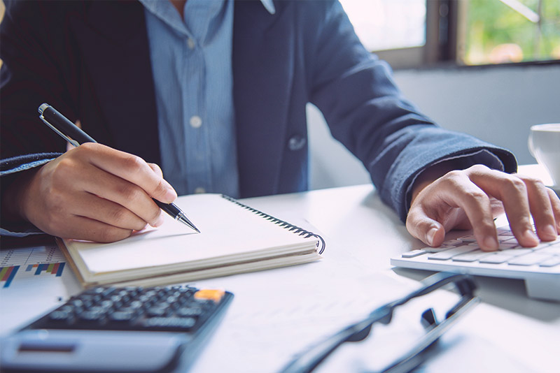 man working on tax season documents