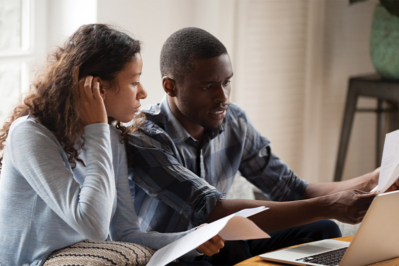 Two people working on their retirement planning