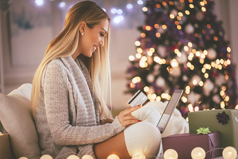 A woman holiday shopping; choosing the right credit card