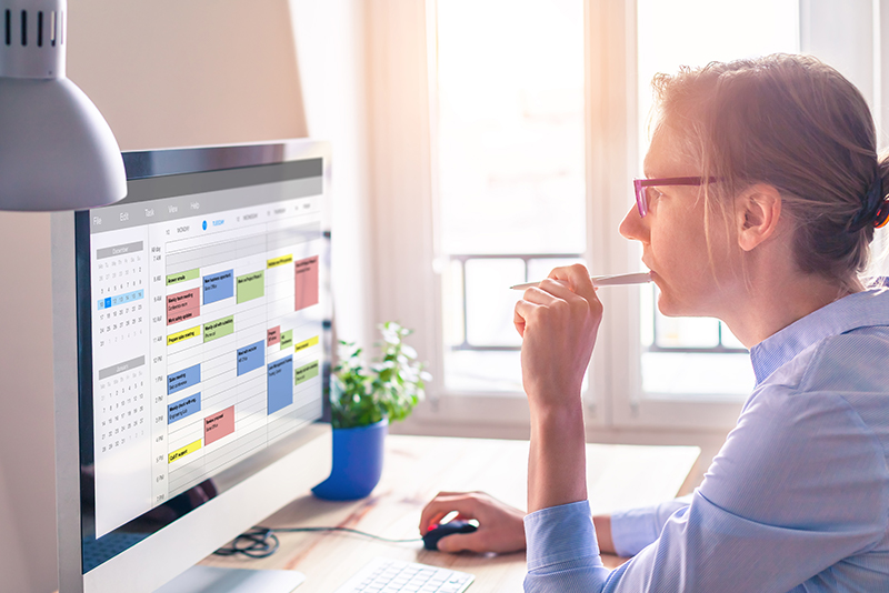 A woman doing financial planning on a computer