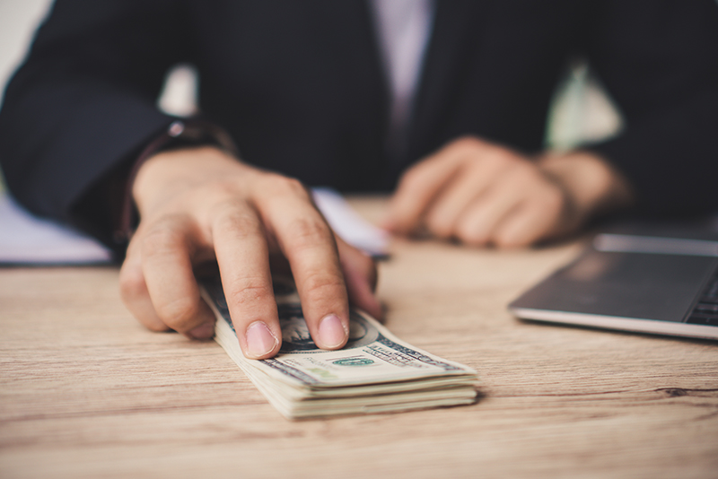 A person banking at a Delaware credit union