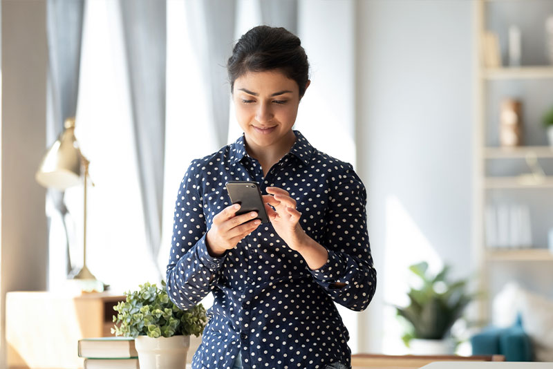 financial needs, woman using smartphone