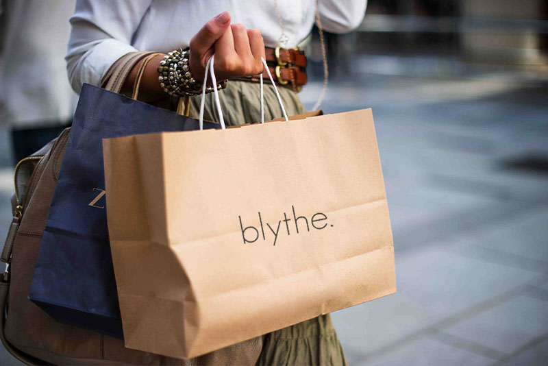 a woman does some retail therapy with Blythe bag