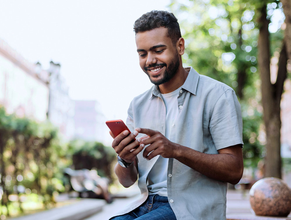 man on phone to open a DEXSTA account