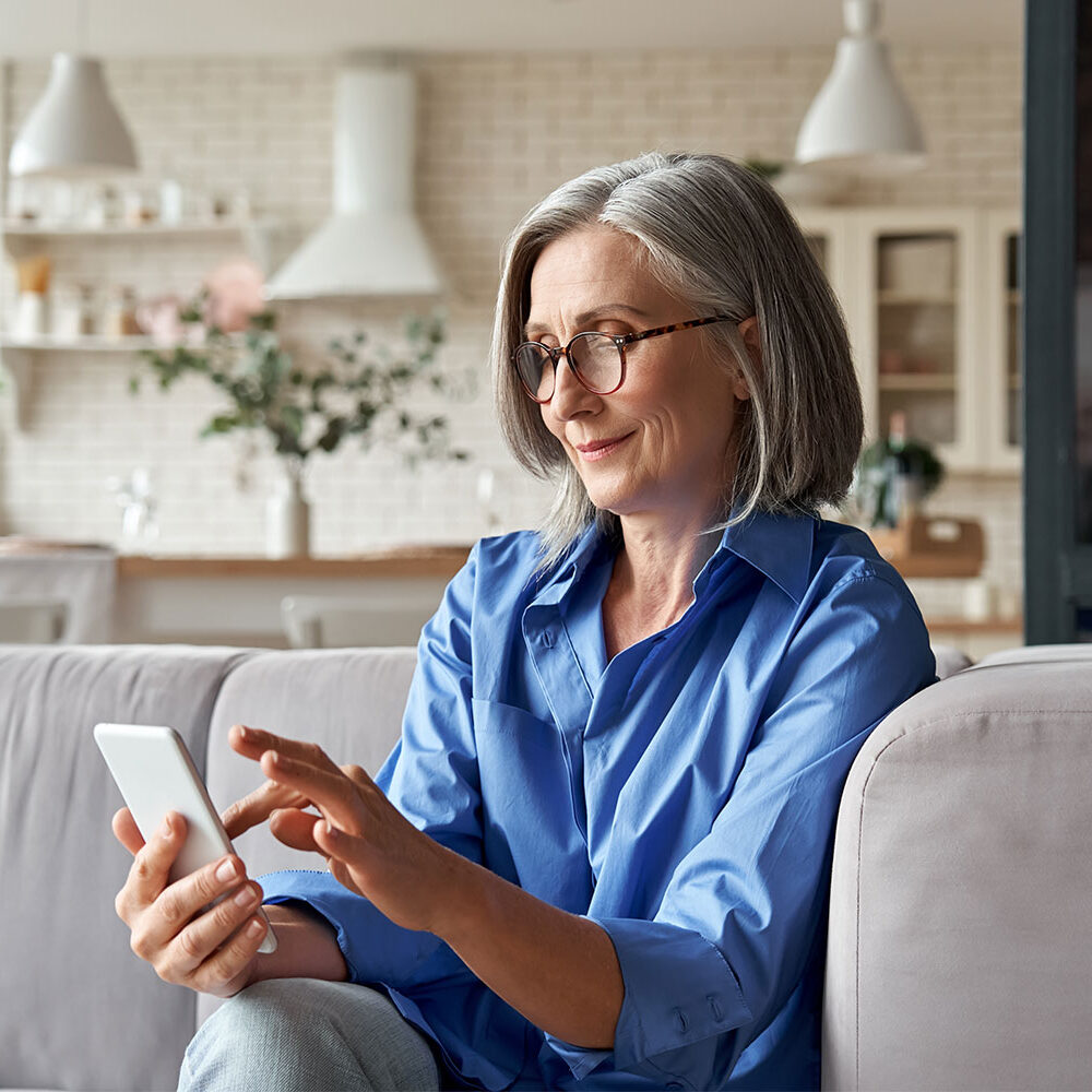 woman on phone for federal credit union accounts